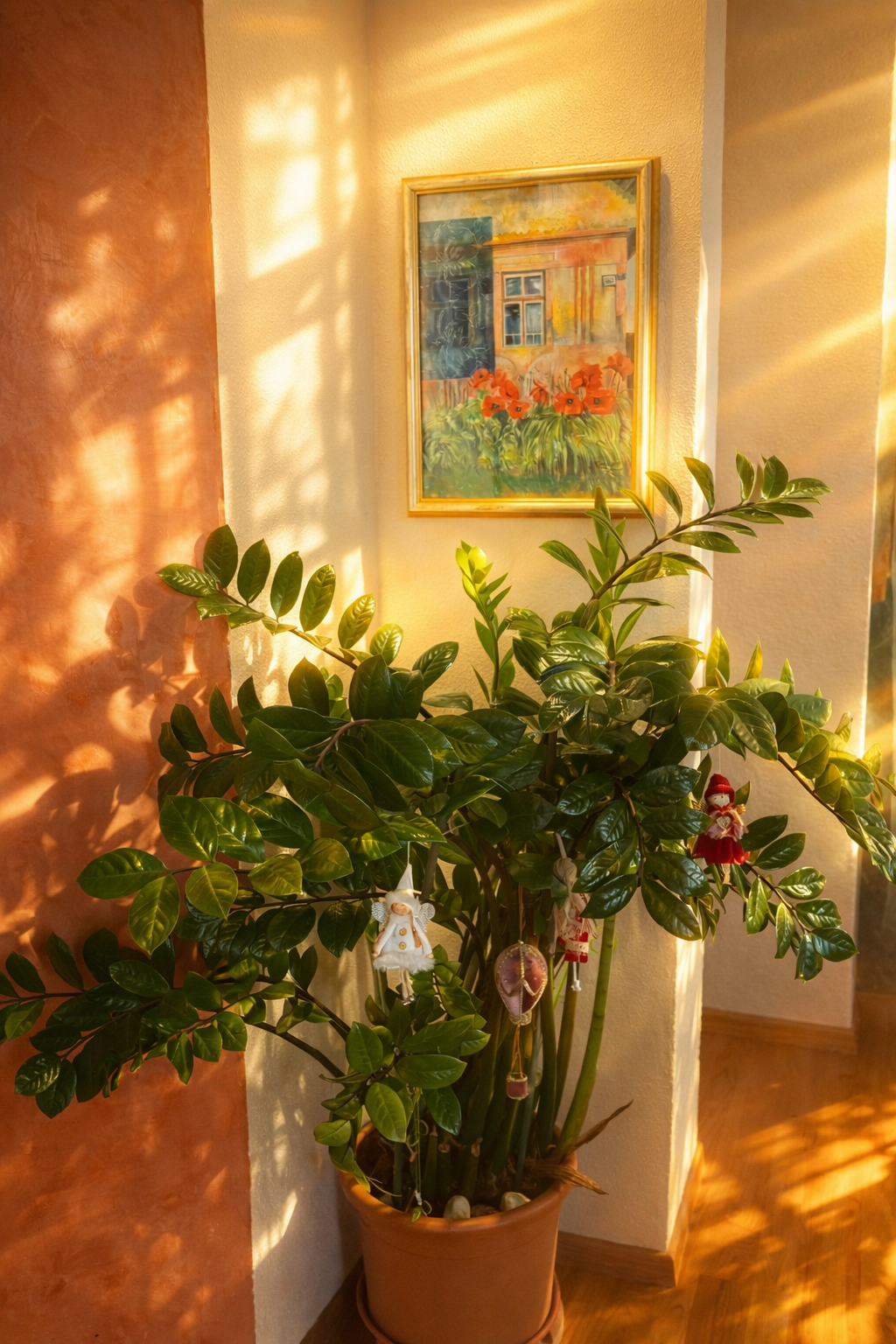 Original painting Liptovské Sliače 1221 by Zuzana Kochanková displayed in collector home interior above large houseplant in warm sunlight