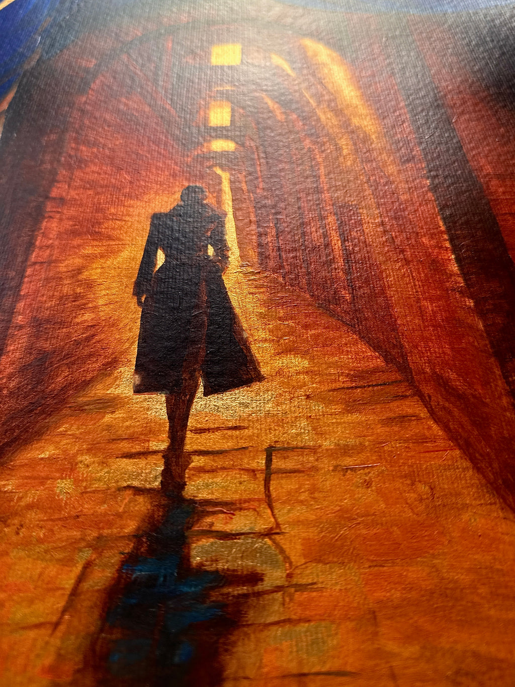 Detail of On the Way showing a solitary female figure walking through a golden architectural passage, with shadow and light emphasizing transition.