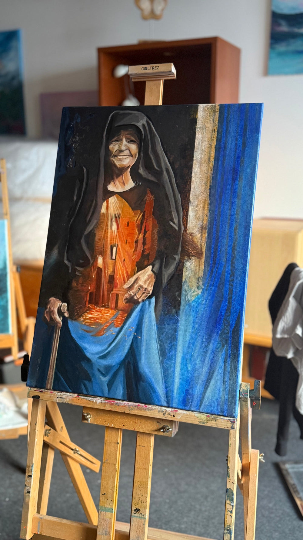 The Light We Carry in studio, a 70 × 50 cm figurative oil painting on canvas.