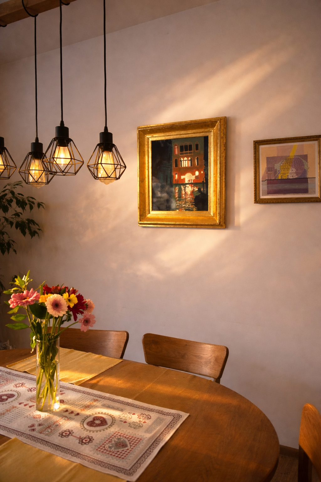 Venice canal painting “Venetian Night” displayed in a warm minimalist dining interior with wooden table, soft evening light, and modern pendant lamps